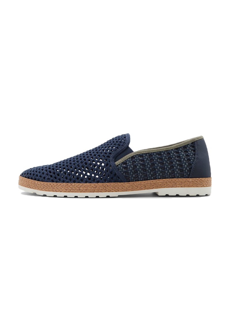 Navy slip-on shoe featuring breathable mesh upper, woven texture, contrasting olive trim, and a light rubber sole with a textured brown edge.