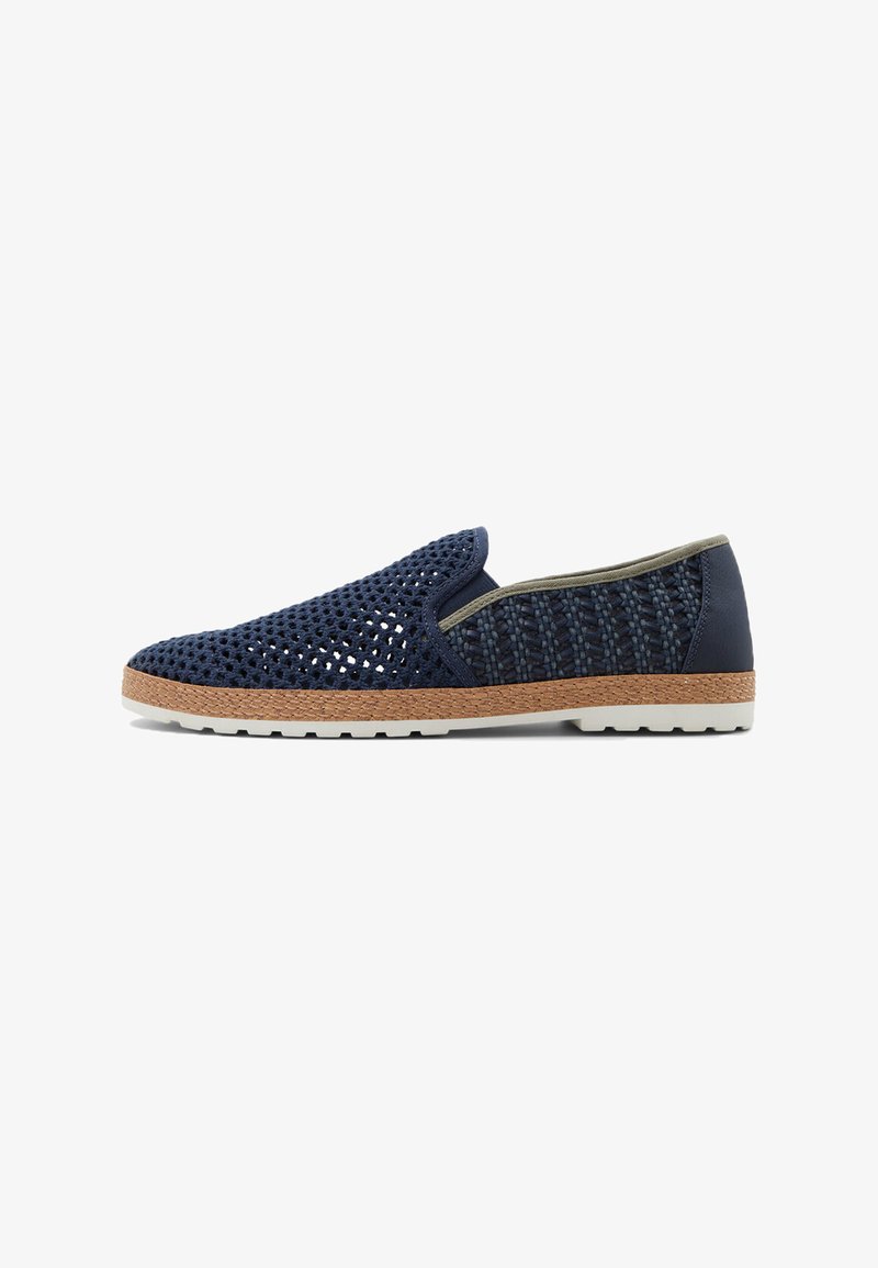 Navy slip-on shoe featuring breathable mesh upper, woven texture, contrasting olive trim, and a light rubber sole with a textured brown edge.