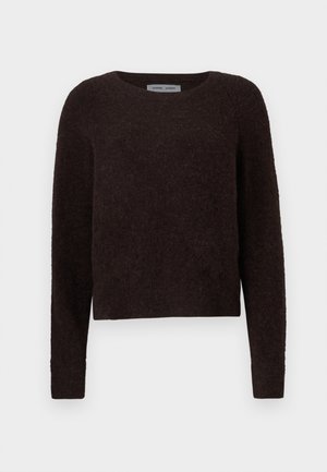 Mørkebrun genser med rund hals, lange ermer og teksturert stoff. Kuttet design med en lett løs passform.