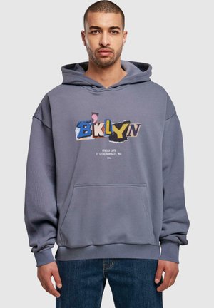 Gray hooded sweatshirt with a front pocket, featuring a graphic text design in various colors and textures. Ribbed cuffs and hem.