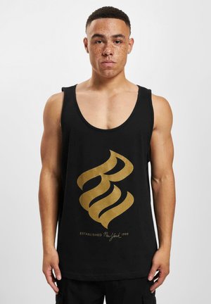 Svart tank top med et stort, gyllent, svungent grafisk design og teksten "ETABLERTE New York 1999" nederst. Enkel, glatt tekstur.