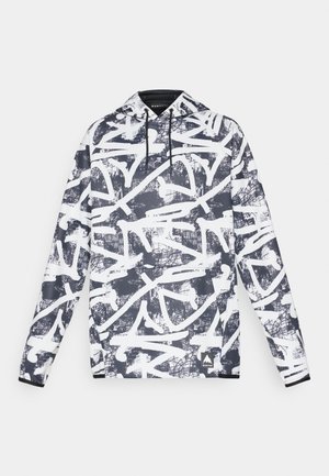 Sweatshirt à capuche avec un motif abstrait de graffiti bleu foncé et blanc. Il a des manches longues, une poche avant et un cordon de serrage pour la capuche.