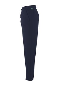 Marineblauwe joggingbroek met een elastische tailleband en koord. Voorzien van zijzakken en geborduurd "Kempa" logo op de linker bovenbeen.