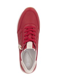 Red leather sneaker with perforated texture, featuring laces and a side zipper, white sole, and beige accent near the heel.