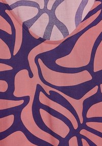 Floral-patterned fabric with abstract shapes in deep purple and soft pink. Features a V-neckline and smooth texture.