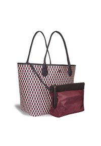 Tote bag with a geometric red, white, and black pattern, featuring leather accents and two long handles. Includes a small maroon pouch.