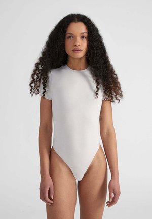 Short-sleeve bodysuit in light gray, made of smooth fabric. Features a high neck and a thong cut at the bottom. Minimalist design.