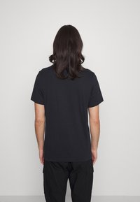 Nike Sportswear FRANCHISE TEE - T-shirt estampada - black