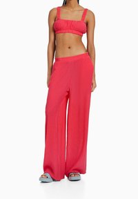 Bershka Kalhoty - coral