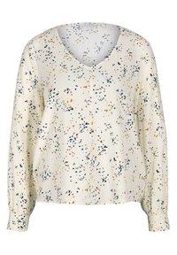 Cremfarbene Bluse mit V-Ausschnitt, langen Ärmeln und lockerer Passform. Sie hat ein mehrfarbiges Punktmuster in Blau, Schwarz und goldenen Akzenten.