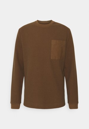 Stickad tröja - brown