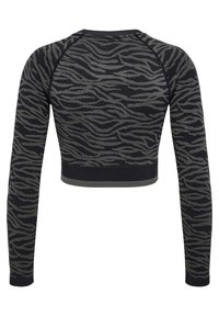 Långärmad kort topp med en mörk bas och ett vågigt grått mönster, som framhäver en modern atletisk design.