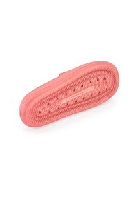 Rubber shoe sole in coral color with a textured bottom featuring grooves and raised dots for grip. Flexible and lightweight design.