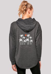 Dark gray, hooded sweatshirt featuring a white palm tree graphic and a red sun on the back, with a relaxed fit and longer hem.
