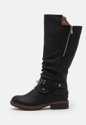 Black leather knee-high boot with slouched upper, side zipper, decorative buckle detail, and brown leather accent at the top. Rubber sole.