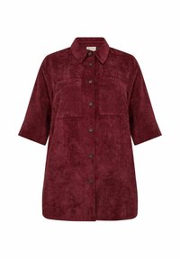 Giacca camicia in corduroy bordeaux con colletto, maniche corte, due tasche frontali e bottoni neri lungo la parte anteriore. Tessuto testurizzato, vestibilità morbida.