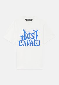 White short-sleeve t-shirt featuring a prominent blue graphic text design with the words "Just Cavalli" and "Fired Earth" printed above.