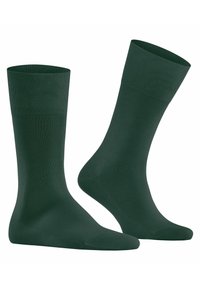 Calcetines verdes oscuros con un pu�ño acanalado, textura suave y forma clásica. Adecuados para ropa casual o formal.