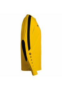 Camicia a maniche lunghe realizzata in tessuto giallo, con dettagli neri sulle spalle e sui polsini, e un motivo circolare lungo le maniche.