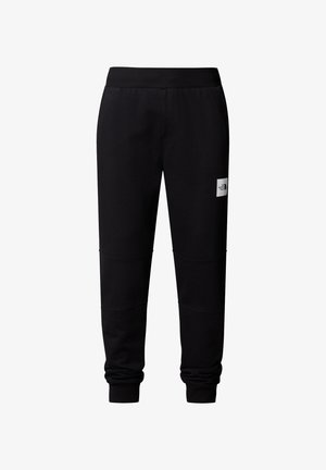 Czarne dresy z miękkiego materiału o zwężającym się kroju, z prążkowanym paskiem w talii i małą naszywką logo z przodu.