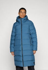 Long blue puffer coat with horizontal padding, zip closure, and hood. Features two side pockets and a slightly flared silhouette. Smooth texture.