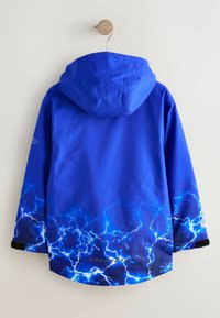 Blue waterproof jacket with a hood. Features a lightning pattern on the lower part and black accents on the cuffs. Smooth texture.
