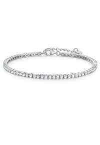 Srebrna bransoletka z rzędem przezroczystych, okrągłych kryształów na elastycznej obręczy. Zawiera karabińczyk oraz łańcuszek przedłużający do regulacji.