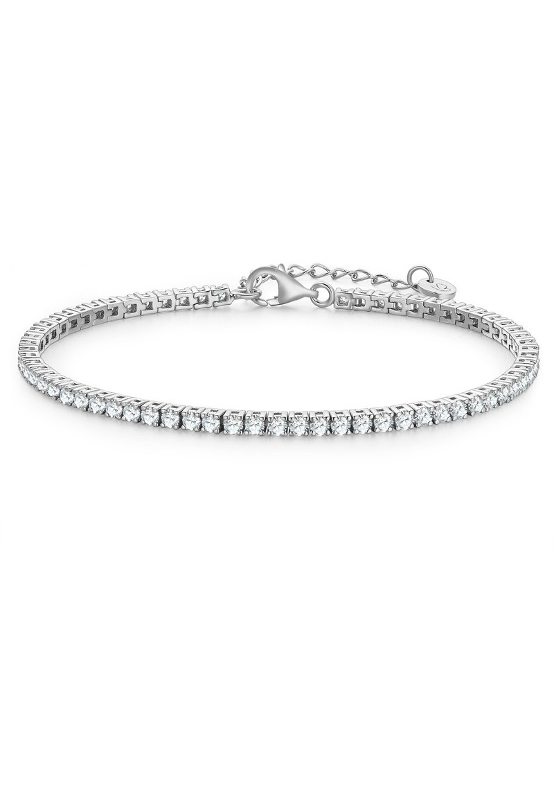 Srebrna bransoletka z rzędem przezroczystych, okrągłych kryształów na elastycznej obręczy. Zawiera karabińczyk oraz łańcuszek przedłużający do regulacji.