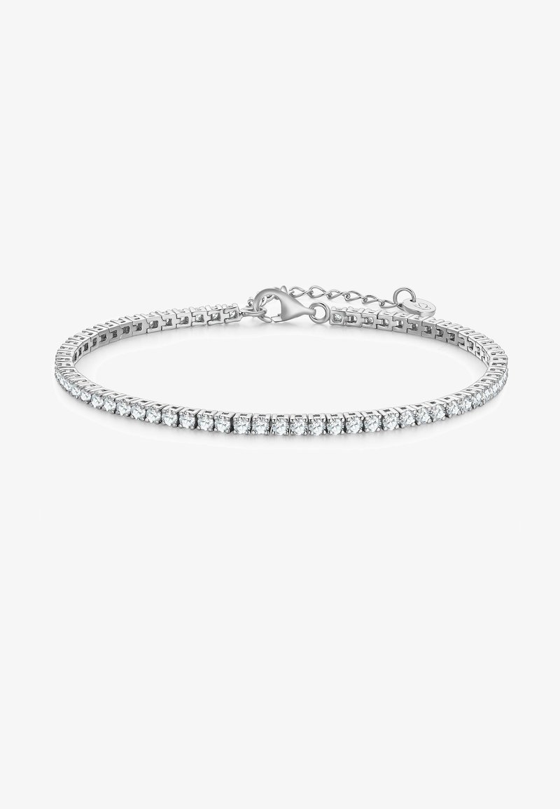 Srebrna bransoletka z rzędem przezroczystych, okrągłych kryształów na elastycznej obręczy. Zawiera karabińczyk oraz łańcuszek przedłużający do regulacji.