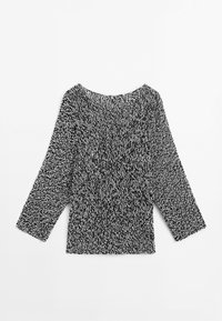 Knit top in black and white with a loose fit, round neckline, and long sleeves. Features a textured pattern and a straight hem.