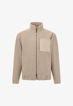 Beige Jacke aus strukturiertem Stoff, mit hohem Kragen, durchgehendem Reißverschluss und einer Brusttasche mit einem kontrastierenden Einsatz.