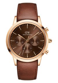 Pruun nahast rihmaga kell roosakuldset ümara kupraga, tumeda pruuni kellapeaga, kronograafi aladega ja hõbedaste tunni markeritega. Bränd: Daniel Wellington.