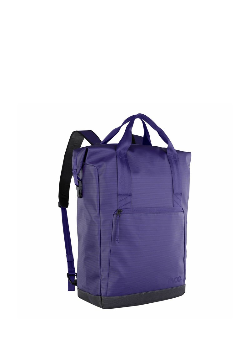 Borsa tote viola realizzata in tessuto resistente, dotata di due manici superiori e una tracolla singola. Include una tasca frontale con cerniera e una base testurizzata.