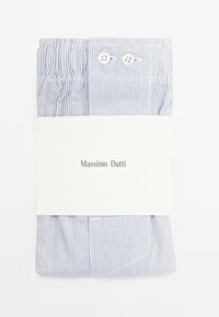 Light blue checkered shirt wrapped with a white band labeled "Massimo Dutti," featuring two buttons and gathered fabric at the top.