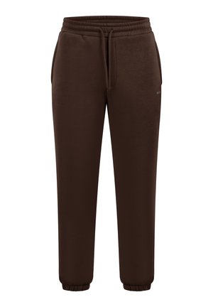 Pantalones deportivos marrones con cintura elástica y cordón, con bolsillos laterales y puños elásticos en los tobillos. Textura de tela suave.