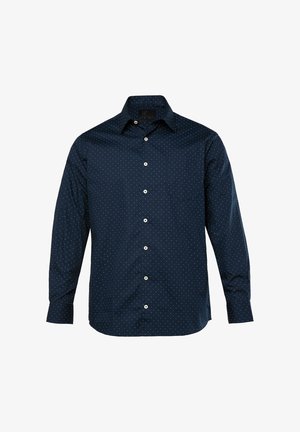 Camisa de manga larga azul marino hecha de tela suave. Cuenta con cierre de botones al frente, cuello y lunares blancos. Incluye un bolsillo en el pecho izquierdo.