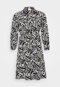 Long-sleeved dress in black and white zebra print, with a collared neckline and a belted waist. Made from a smooth, lightweight fabric.