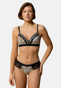 Soutien-gorge noir avec dentelle et culotte assortie à imprimé floral en noir, blanc et or. Tissu doux, design en v, bretelles élastiques.