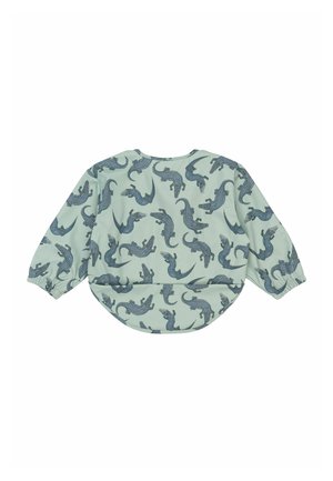 Light green textile top with long sleeves, featuring a repeated blue crocodile pattern. Rounded hem with elastic cuffs.