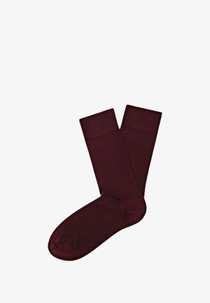 Burgunderfarvede bomuldsblandesokker med ribbet struktur, der har et kontrasterende manchet-design. Glat overflade og standard crew længde.