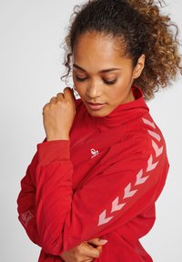 Hummel TRACK JACKET WOMAN - Trainingsvest - aura orange