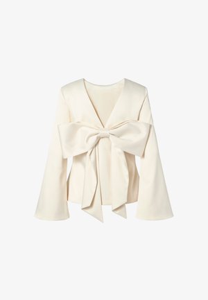White long-sleeve blouse featuring a deep V-neck and a large bow accent at the front, crafted from smooth fabric with a structured design.