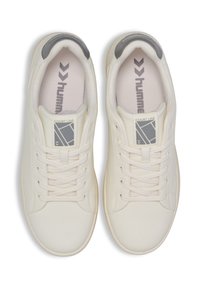 White leather sneakers with a textured finish, grey accents on the heel, and logo on the tongue; features flat laces and perforated side details.