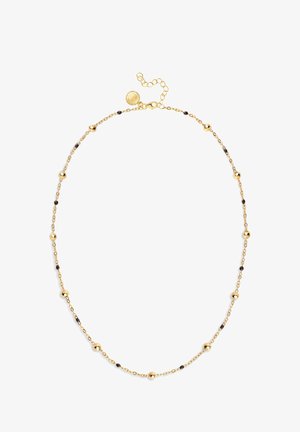 Złota naszyjnik z małymi okrągłymi koralikami i ciemnymi akcentami, z delikatnym łańcuszkiem i regulowanym zapięciem pozwalającym na zmianę długości.