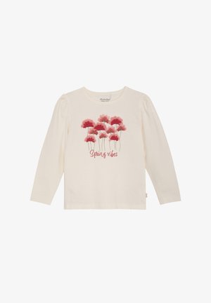 Chemise crème à manches longues avec des fleurs roses et rouges et les mots "Spring vibes" imprimés sur le devant.