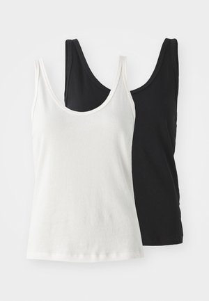 Dos camisetas de tirantes de algodón: una blanca y una negra. Ambas tienen un escote redondo y tirantes finos, mostrando una textura suave y lisa.