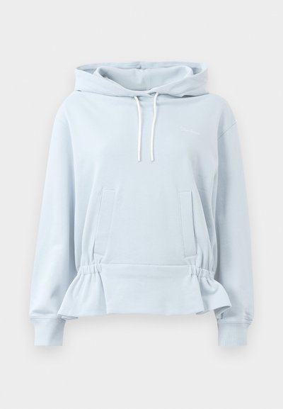 Light blue pullover hoodie with a drawstring, side pockets, and a peplum hem. Soft fabric with ribbed cuffs and a simple logo detail.