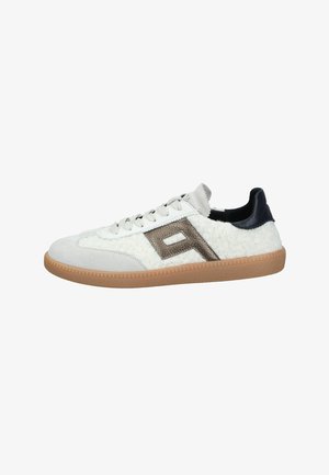 White sneakers with textured wool-like material, grey suede accents, dark blue heel, and a metallic logo detail on the side. Rubber sole.