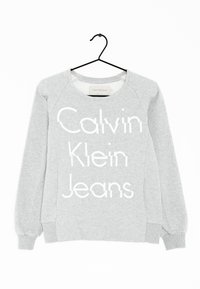 Gray sweatshirt with a round neckline, long sleeves, ribbed cuffs, featuring white text "Calvin Klein Jeans" prominently on the front.