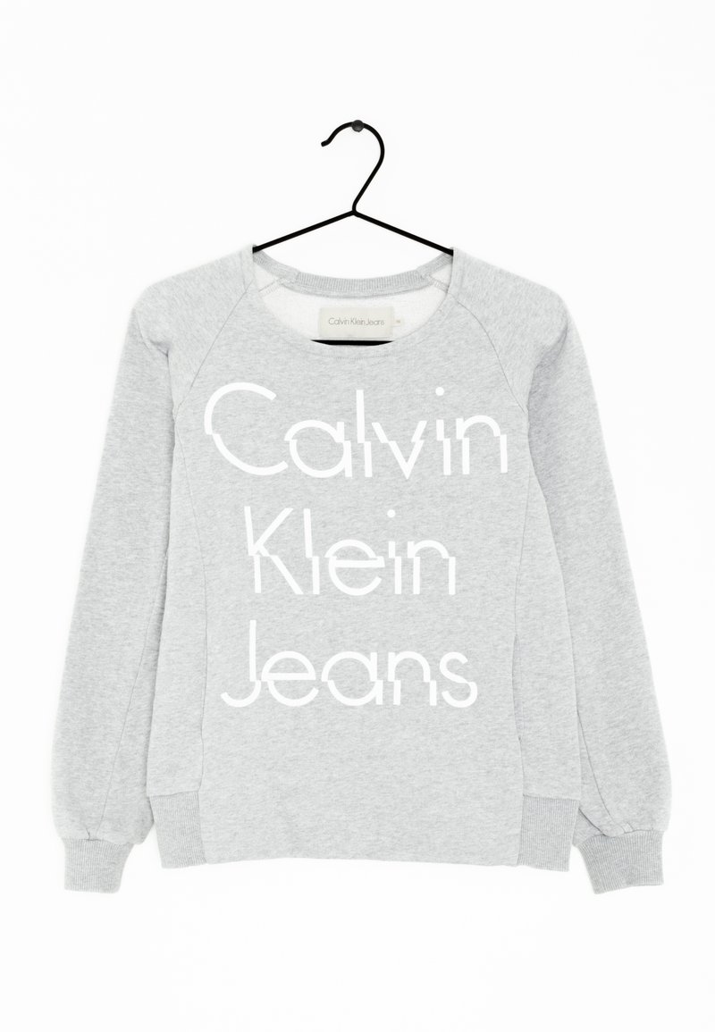 Gray sweatshirt with a round neckline, long sleeves, ribbed cuffs, featuring white text "Calvin Klein Jeans" prominently on the front.